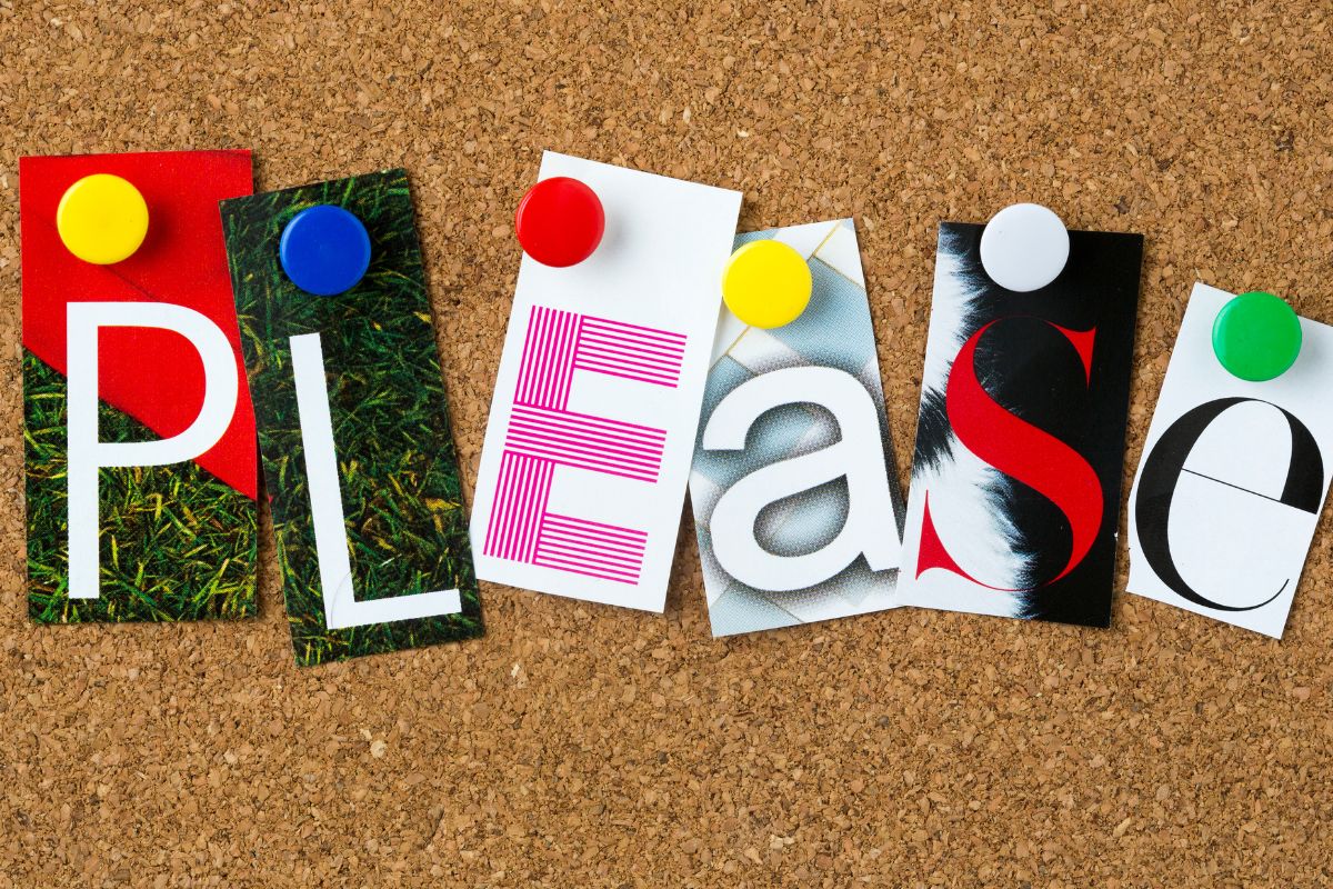 This image shows the word “PLEASE” spelled out using individual cut-out letters, each pinned to a corkboard with colorful push pins. The letters appear to be sourced from different printed textures and styles, creating a collage-like effect. Each letter has its own unique background, ranging from grass textures to bold graphic patterns, adding visual interest and contrast. The corkboard background introduces a warm, tactile element, while the push pins—red, blue, yellow, and white—add pops of color and a casual, handmade feel. The arrangement feels playful yet intentional, emphasizing the importance of polite language while keeping the tone approachable and creative. The image suggests learning, communication, and everyday manners in a friendly, non-institutional way.